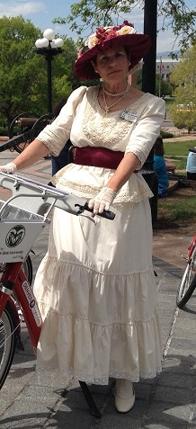 a person holding a bicycle