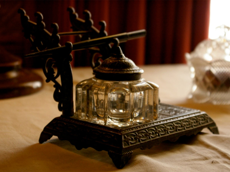 a vase sitting on top of a wooden table