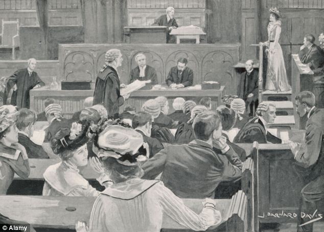 a group of people sitting around a baseball field