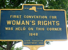 a street sign with trees in the background