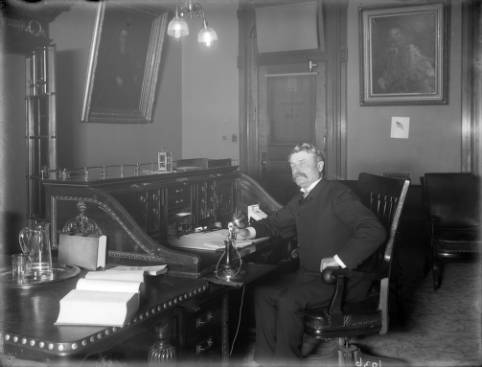 a man sitting in front of a window