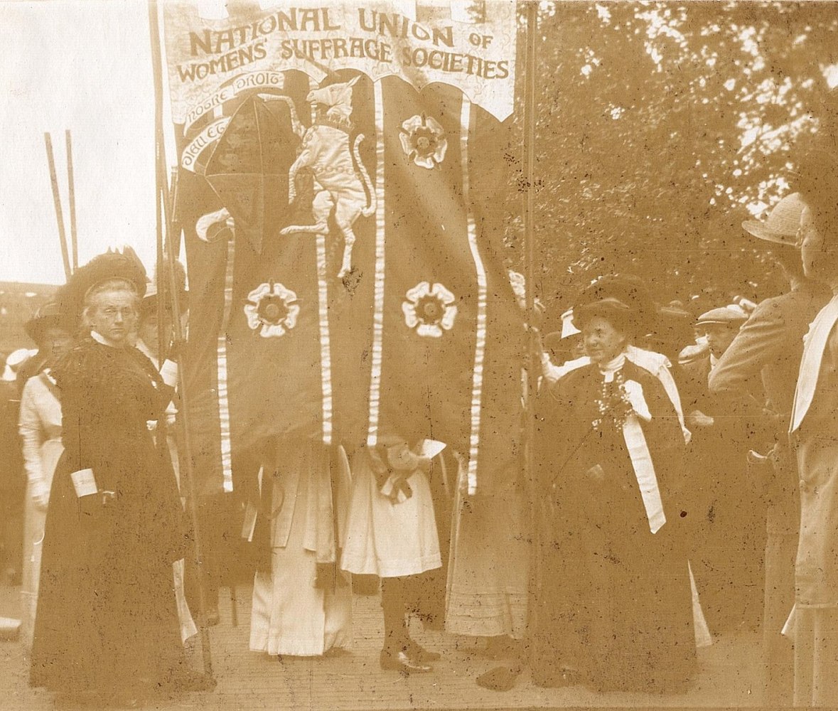 a vintage photo of a group of people posing for the camera