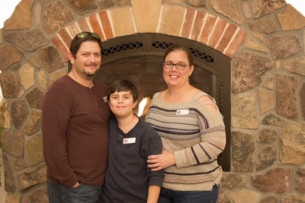 a person standing in front of a brick building