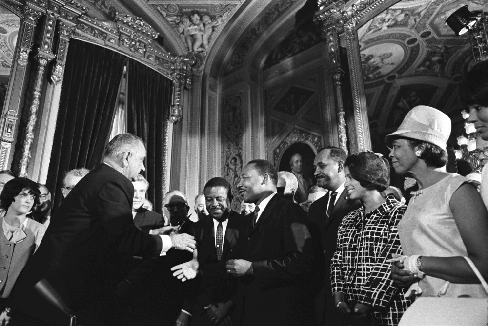 Ralph Abernathy, Clarence M. Mitchell standing in front of a crowd