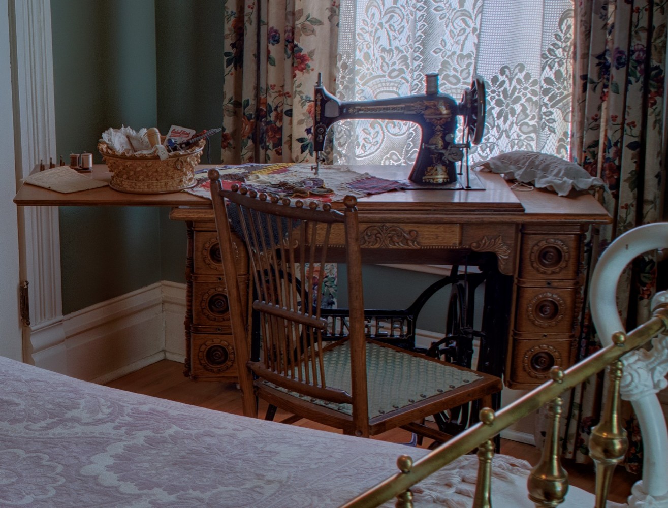 a bedroom with a bed and a chair in a room