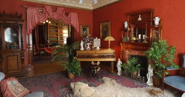 a living room filled with furniture and a fireplace