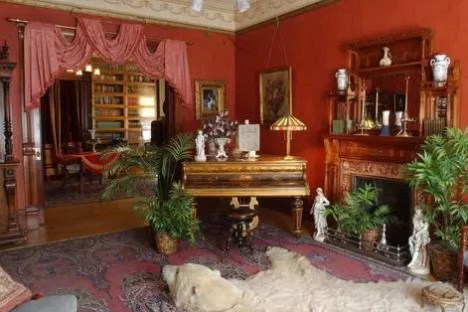 a living room filled with furniture and a fireplace