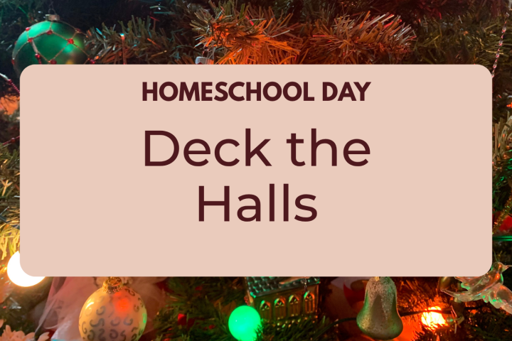 Sign with 'Homeschool Day Deck the Halls' on a Christmas tree background.