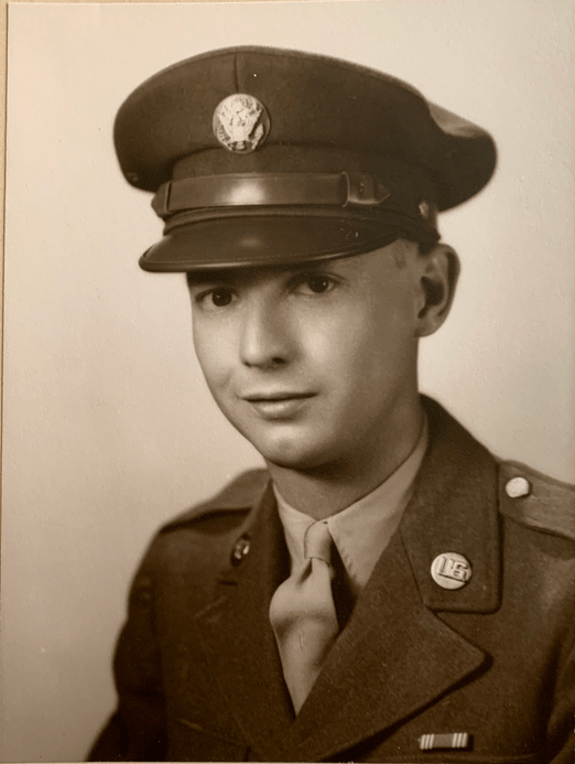 Portrait of a uniformed soldier from the mid-20th century wearing a cap.